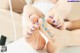 A woman is getting her feet examined by a doctor.